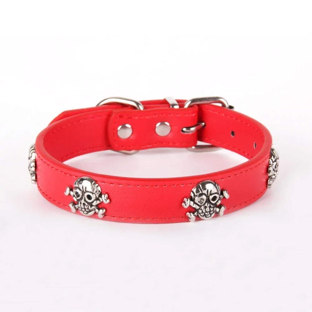 Red dog collar with skull designs on a white background