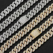 Two diamond, silver, and gold Cuban link chain necklaces, one gold and one silver, on a black background.