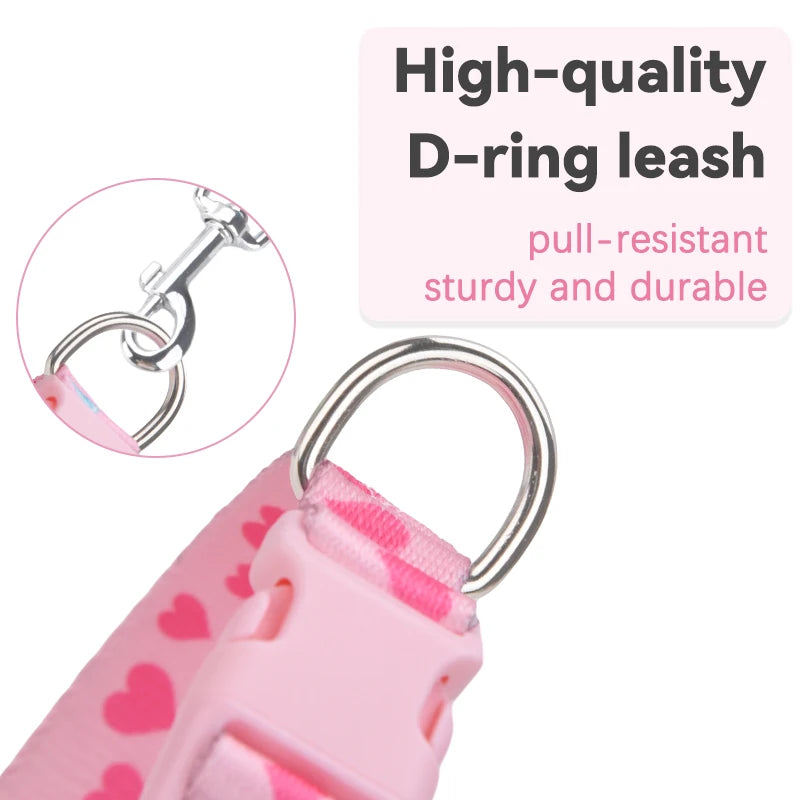 Pink leash with D-ring and heart pattern, featuring text on a white background.