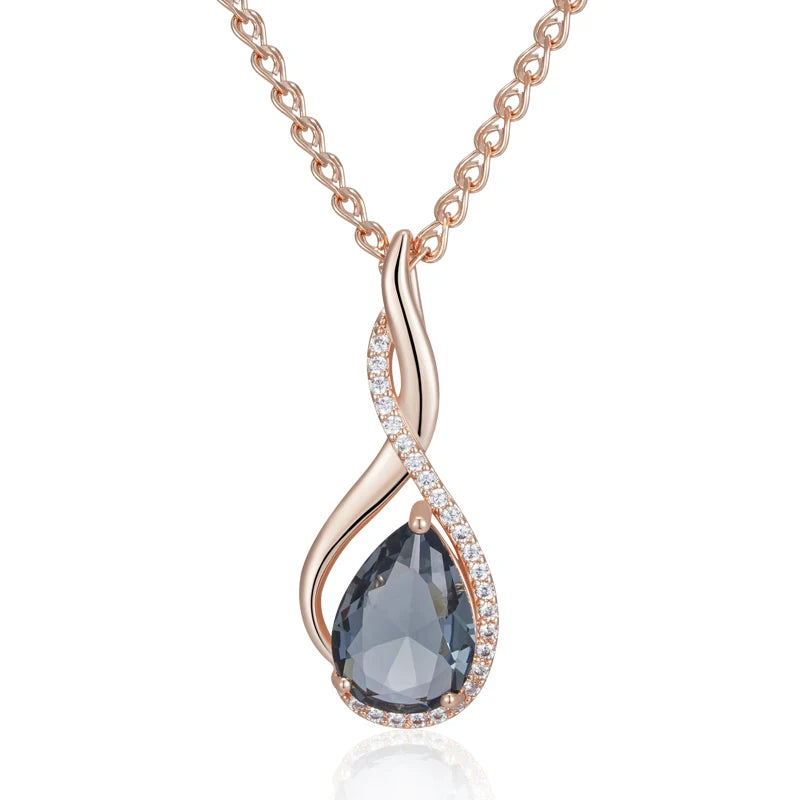 Rose gold necklace with a teardrop-shaped gemstone on a white background