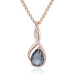 Rose gold necklace with a teardrop-shaped gemstone on a white background