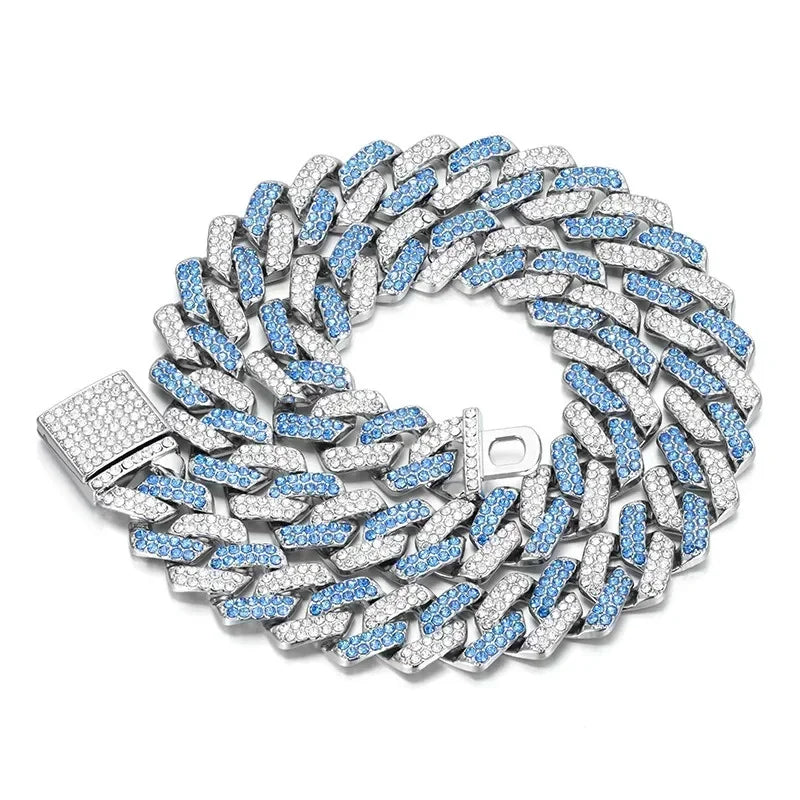 Silver and blue Cuban link chain necklace on a white background