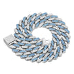 Silver and blue Cuban link chain necklace on a white background