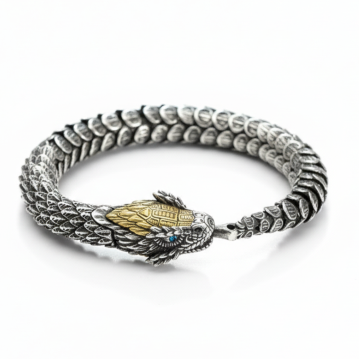 Silver bracelet with dragon head design on a white background