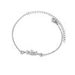 Silver bracelet with a floral design on a white background