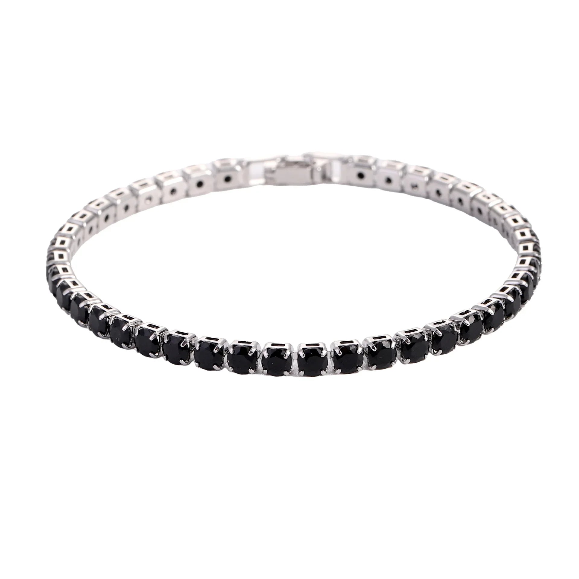 Silver bracelet with black stones on a white background