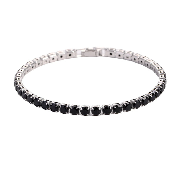 Silver bracelet with black stones on a white background