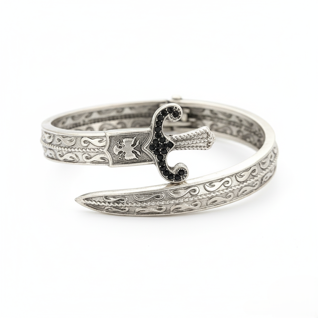 Silver bracelet with intricate design on a white background