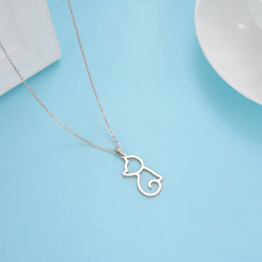 Silver cat-shaped pendant necklace on a light blue background