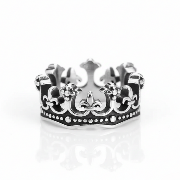 Silver crown-shaped ring on a white background