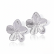 Silver flower-shaped earrings on a white background