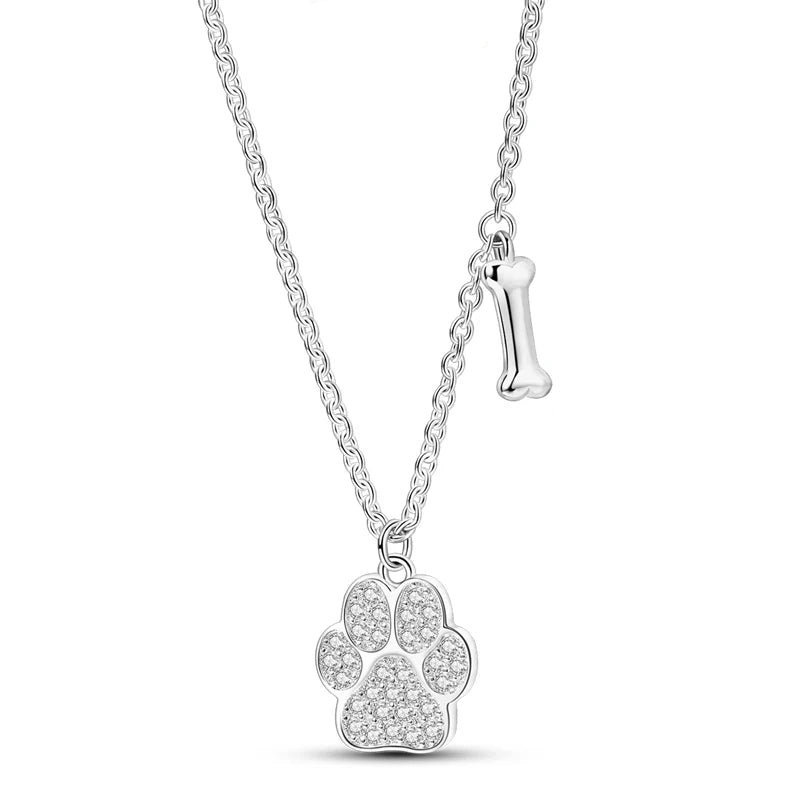Silver paw print pendant necklace on a white background