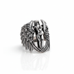 Silver ring with angel design on a white background