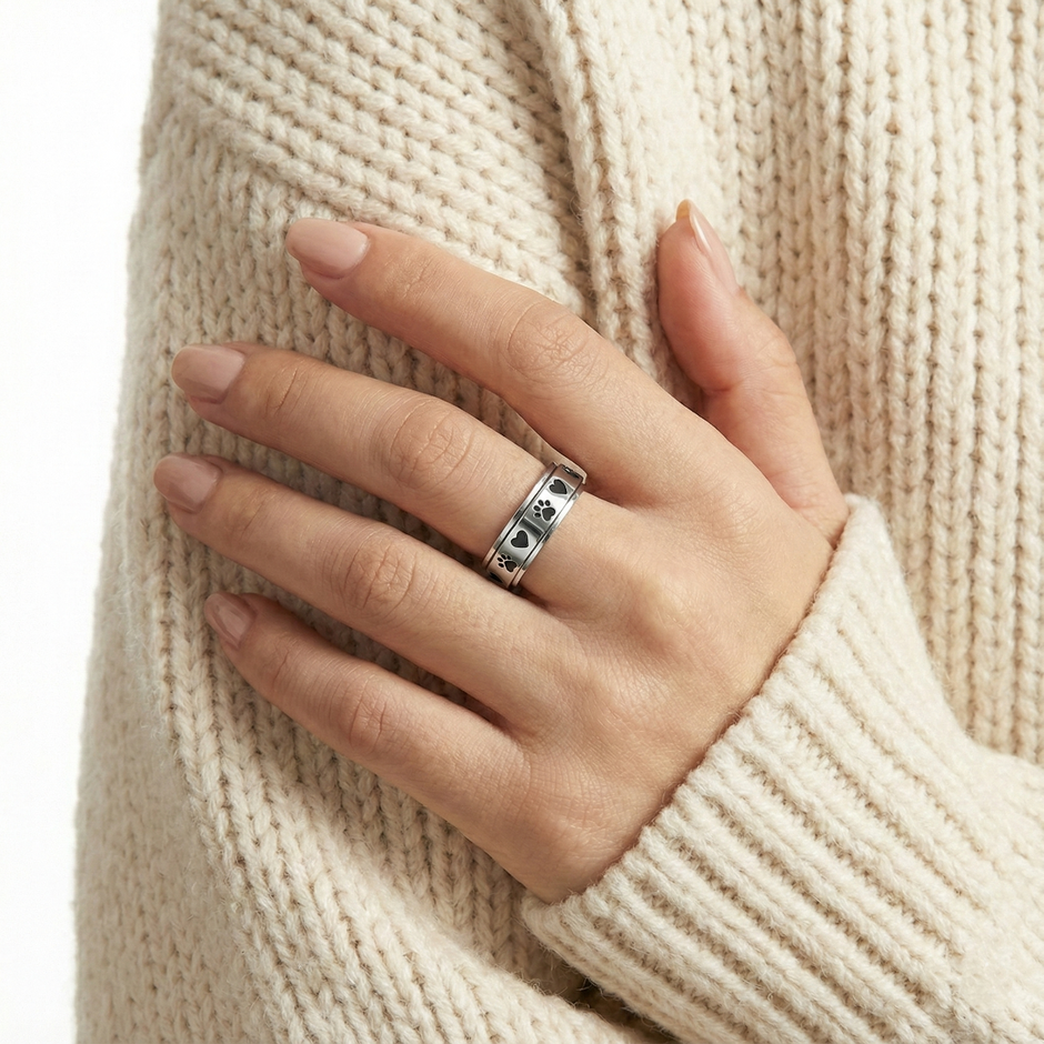 person using the Animal Lover's Relaxing Ring for stress relief at work.