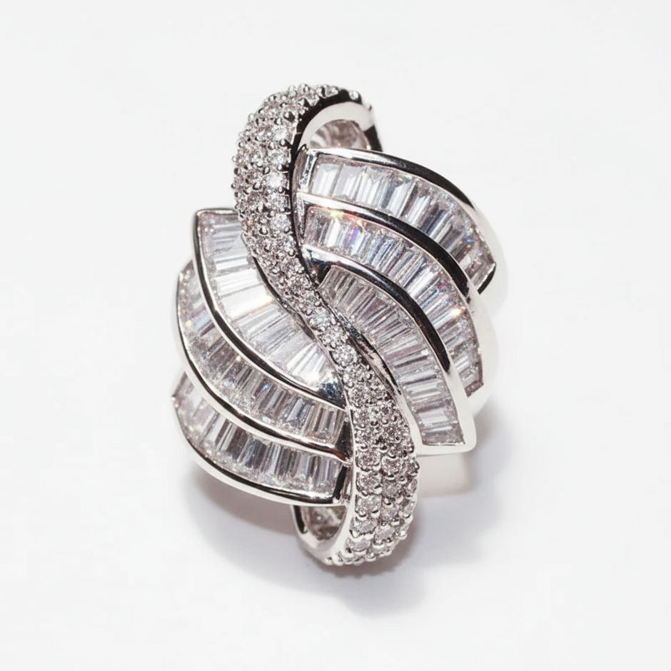 Silver ring with diamond accents on a white background