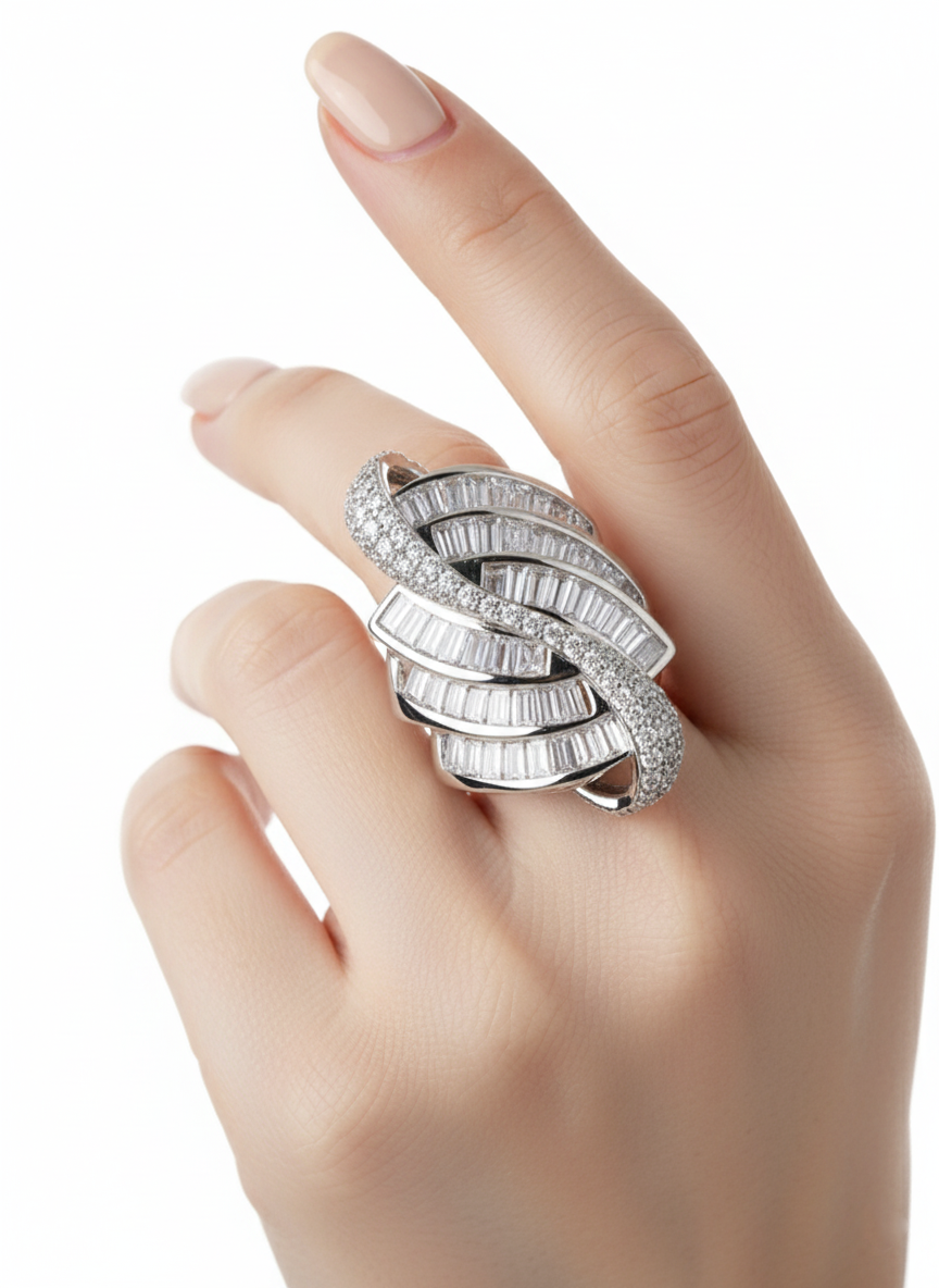 Silver ring with diamonds on a hand against a white background
