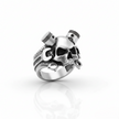 Silver ring with skull and piston design on a white background