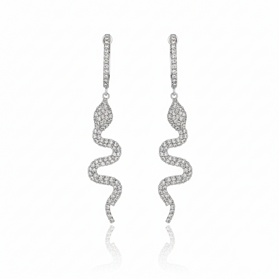  Pair of silver-Serpent Spark Dangle Earrings featuring pavé-set rhinestones. 
