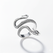 Silver snake-shaped ring on a white background