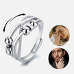 Silver spinning bead anti-anxiety ring with lifestyle images of a woman and man on a white background.
