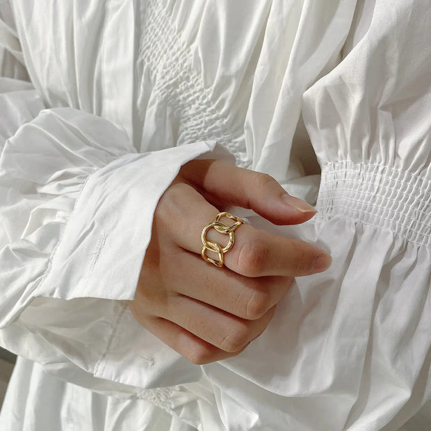 The Link Ring features a sleek, interconnected design inspired by classic chain links, finished in radiant gold over S925 silver. Lightweight, durable, and effortlessly chic