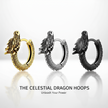 Three dragon-shaped hoop earrings in gold, silver, and black on a white background.