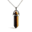 Tiger's eye crystal pendant on a silver chain 
A natural carnelian crystal in a precision hexagonal cut, wire-wrapped and suspended on an adjustable chain - wearable energy for the conscious woman.