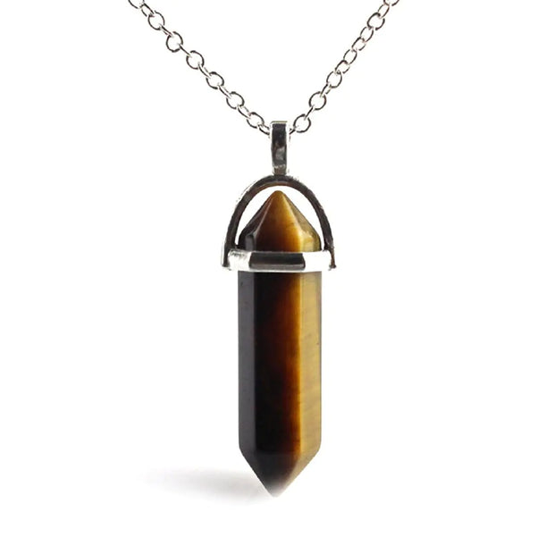 Tiger's eye crystal pendant on a silver chain 
A natural carnelian crystal in a precision hexagonal cut, wire-wrapped and suspended on an adjustable chain - wearable energy for the conscious woman.