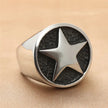 Titanium Signet Ring with Star Engraving on a beige background