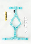 Turquoise dog harness on a white background with text about comfort and adjustability.