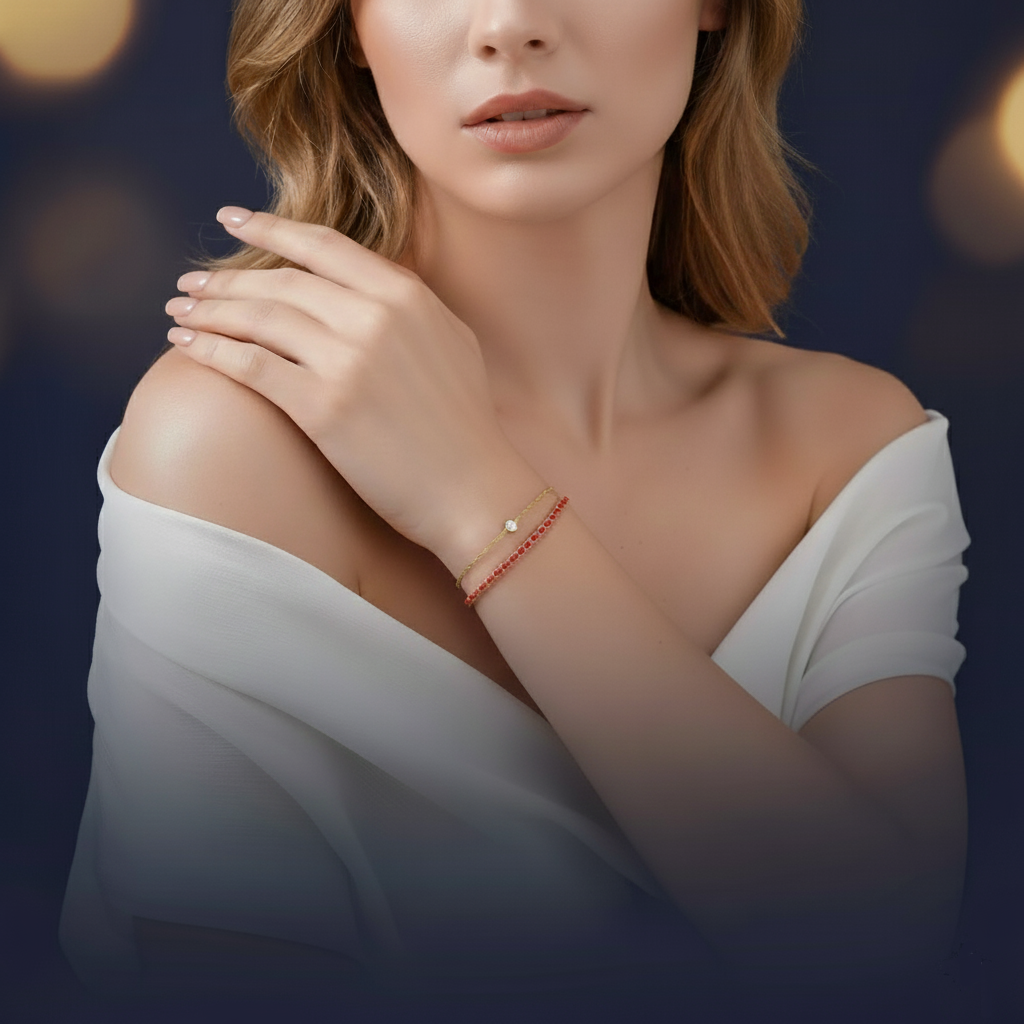 Woman wearing a white off-shoulder top with Two gold bracelets with red beads background