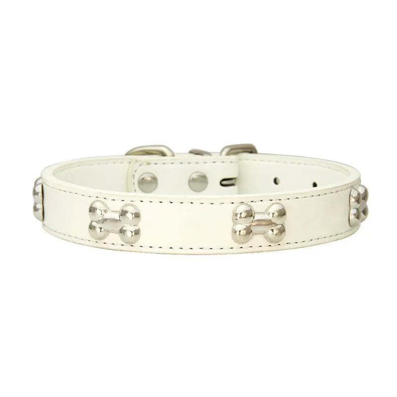 White dog collar with bone-shaped studs on a white background