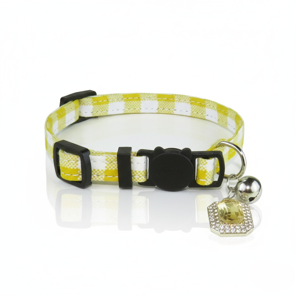 Yellow and white checkered dog collar with a black buckle and silver bell on a white background