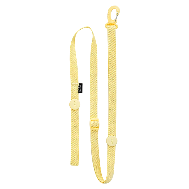 Yellow dog leash with a clip on a white background