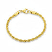 Gold rope chain bracelet on a white background