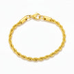 Gold rope chain bracelet on a white background