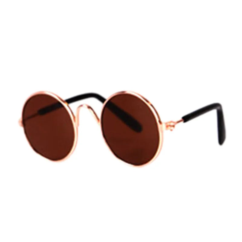 Round sunglasses with rose gold frame and brown lenses on a white background