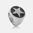 Silver ring with star design on a light gray background