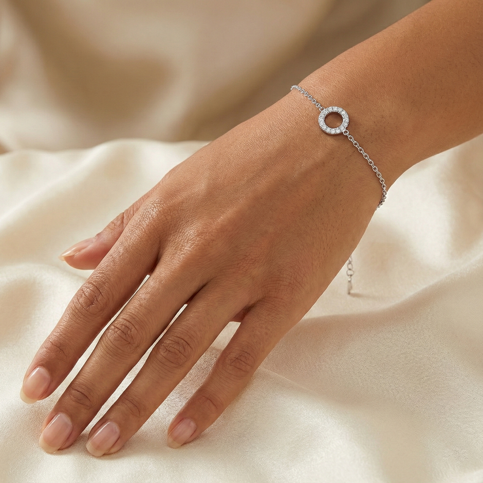 Close-up of the sparkling rhinestone circle centerpiece on the silver-plated bracelet.