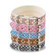 Stack of colorful patterned dog collars with silver buckles on a white background