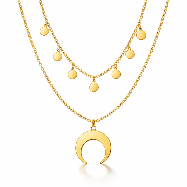 Gold necklace with a crescent moon pendant on a white background