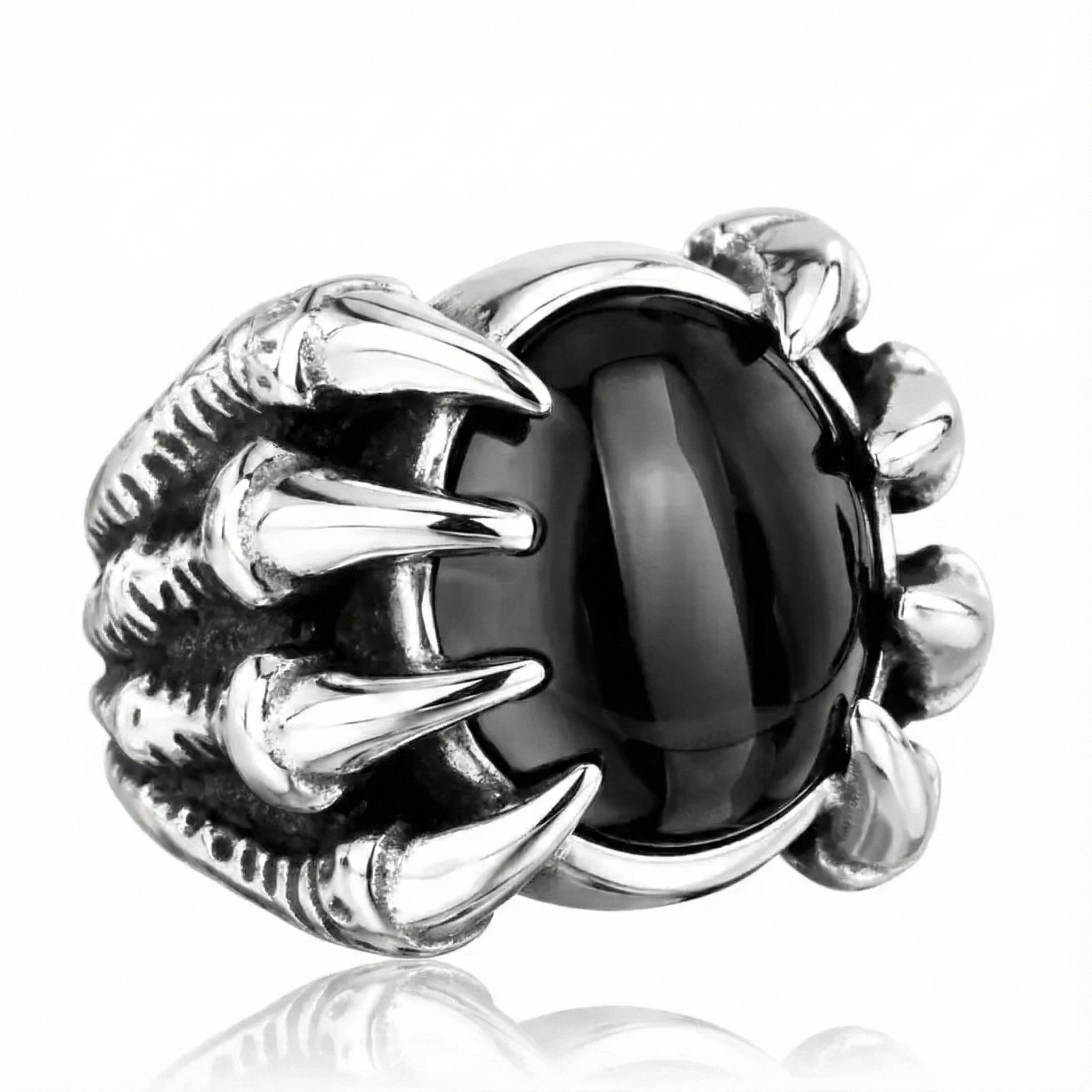 Silver ring with black gemstone on a white background