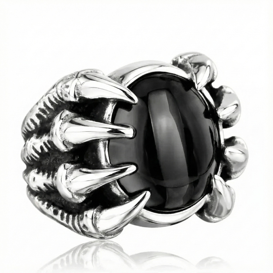 Silver ring with black gemstone on a white background