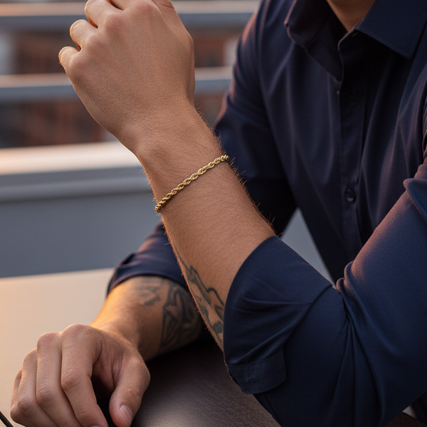 Close-up of gold bracelet  on man hand with a gold bracelet.
