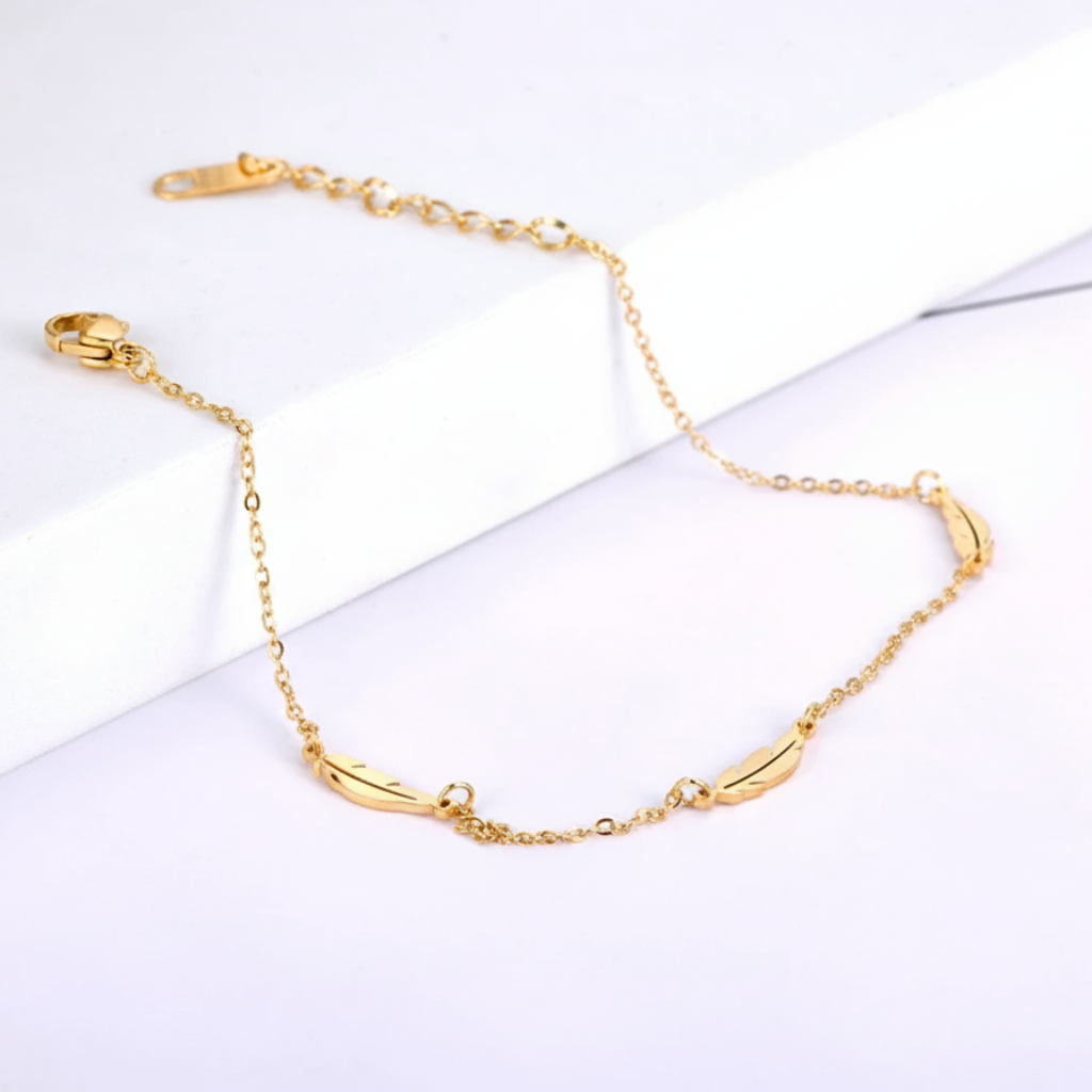 Gold Feather Ankleton a white background