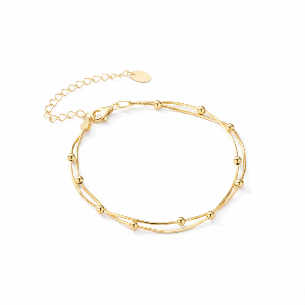 Gold bracelet on a white background