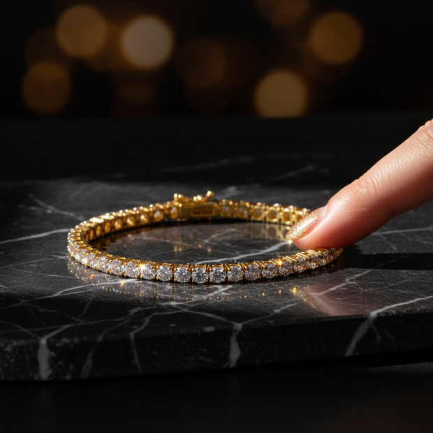 gold bracelet with AAA+ cubic zirconia on a black marble surface
