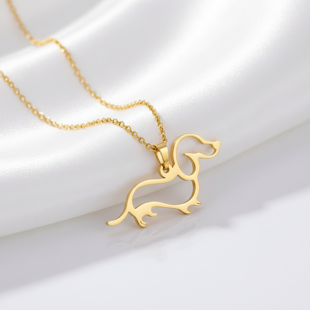 Gold dachshund-shaped pendant on a chain 