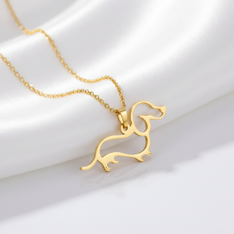 Gold dachshund-shaped pendant on a chain 