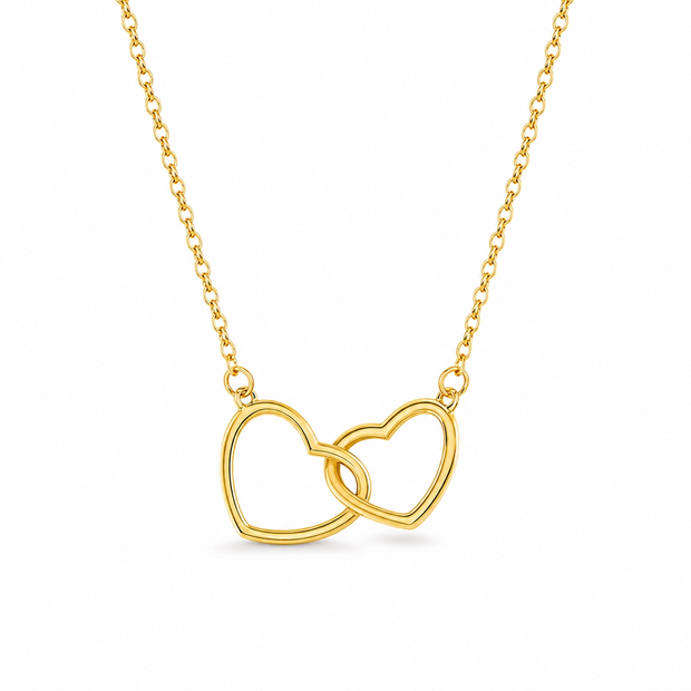 Gold necklace with interlocking heart pendants on a white background